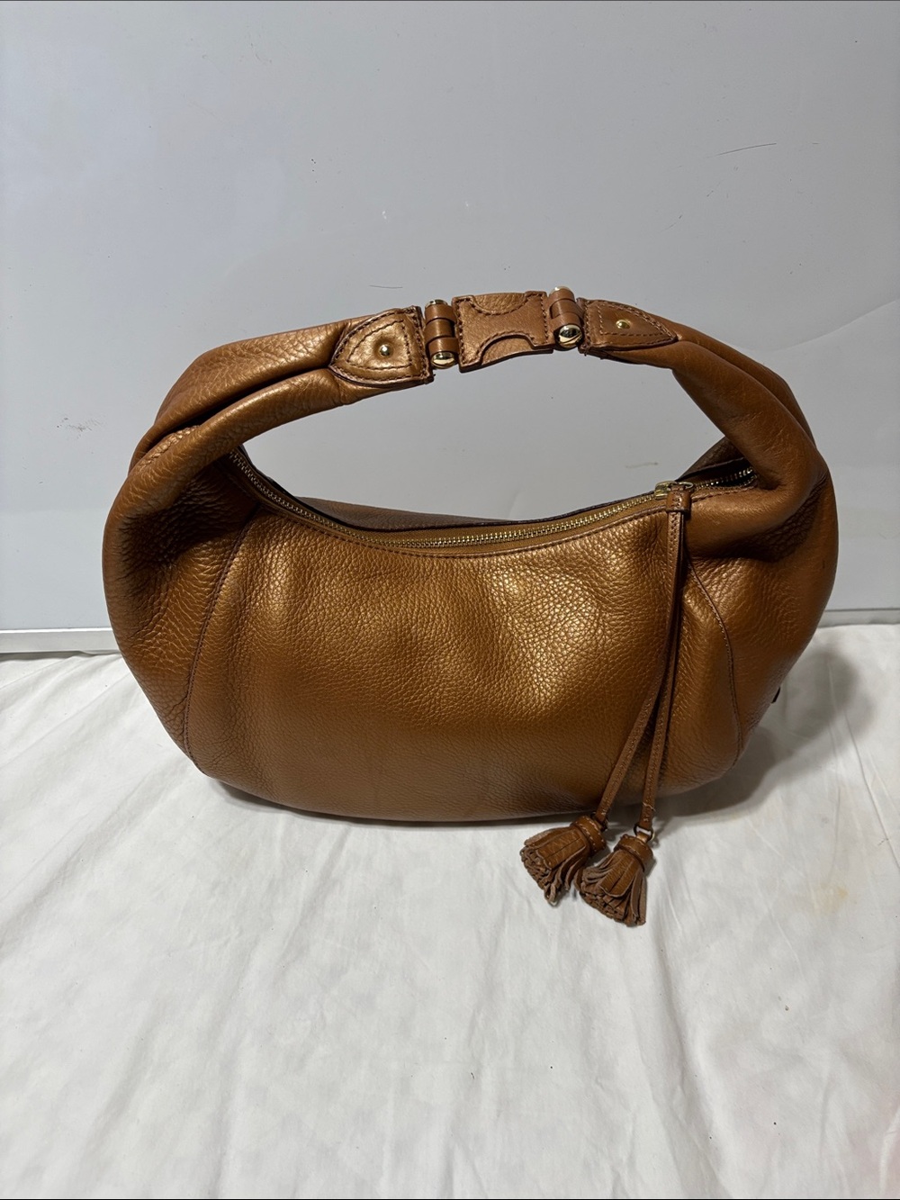 Cole Haan gold- Tan pebble Leather bag with Logo Patch. Vintage - never worn.